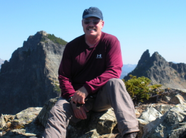 Dan sitting on rock at Pinacle Peak