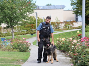 Justin Worthington and K9 Sam outside
