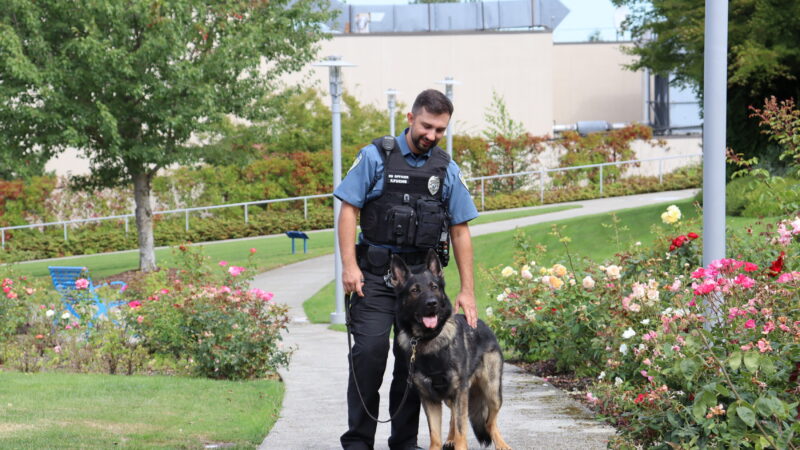 Justin Worthington and K9 Sam outside