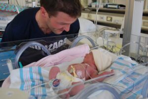Mike Jackson with daughter in the NICU