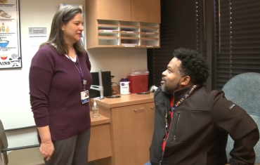 Social worker Jenn speaking with patient