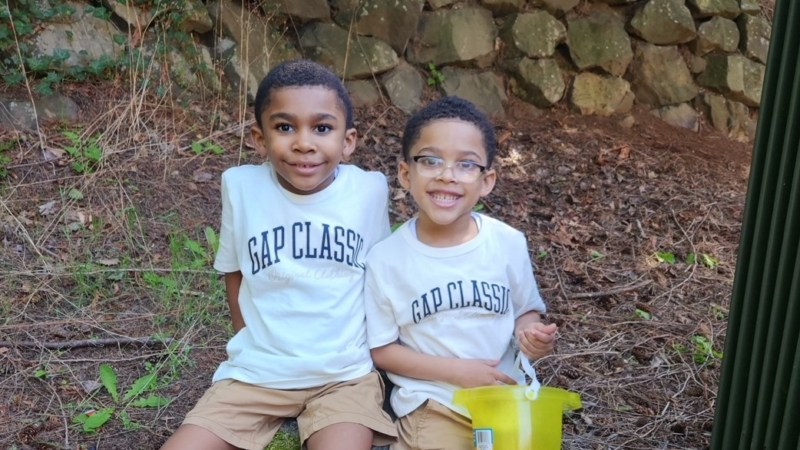 Two brothers smiling at the camera