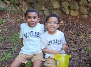 Two brothers smiling at the camera