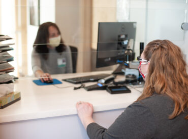 Patient at MultiCare Health System check-in desk