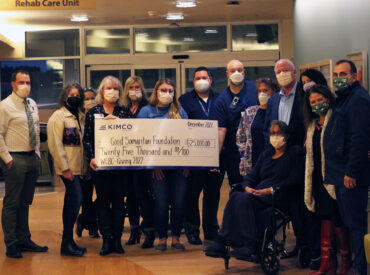 Kimco Realty and Good Samaritan Foundation team presenting check