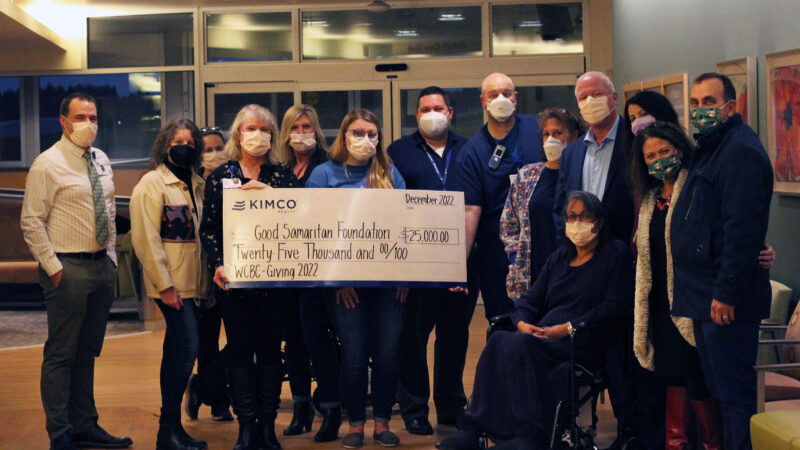 Kimco Realty and Good Samaritan Foundation team presenting check