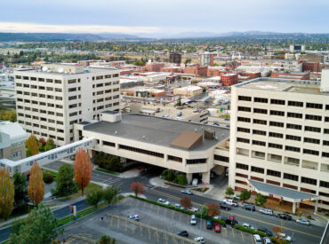 White multi-level building in downtown area