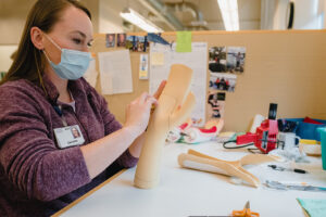 Christine working on a orthotic device